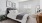 carpeted bedroom with natural lighting