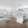 open concept living spaces with ample lighting throughout