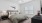 spacious bedroom with ceiling fan and light fixture