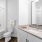 shower/tub combo in well lit bathroom
