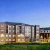 twilight shot of Pine + Parker apartments lit at twilight